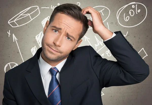 Thoughtful young businessman — Stock Photo, Image