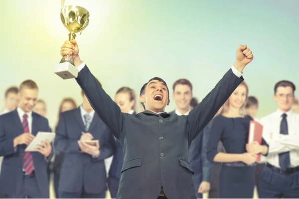 Equipo de negocios con trofeo de oro —  Fotos de Stock