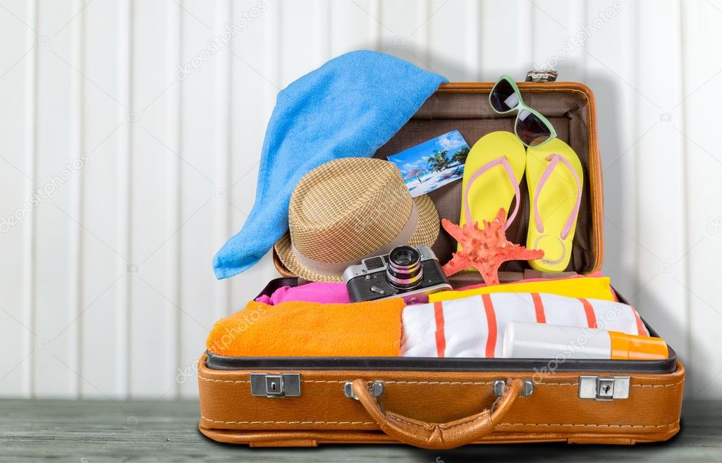 retro suitcase with travel objects