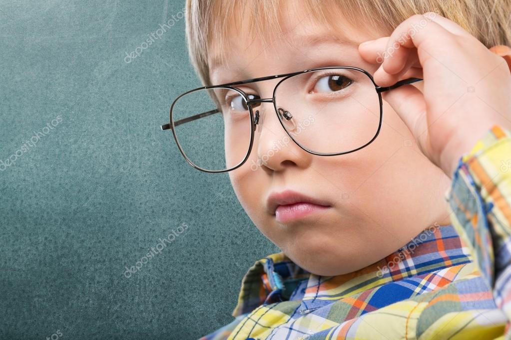 Cute young boy with glasses Stock Photo by ©billiondigital 118714998