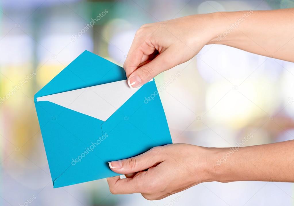 woman hands holding an envelope
