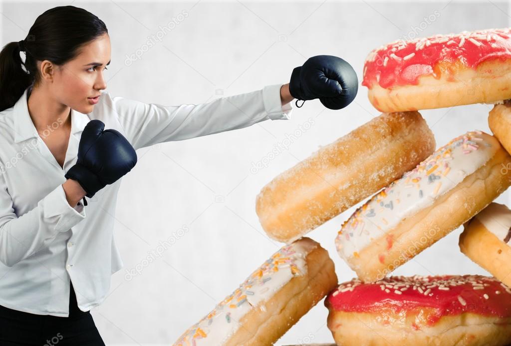 young woman fighting off fast food