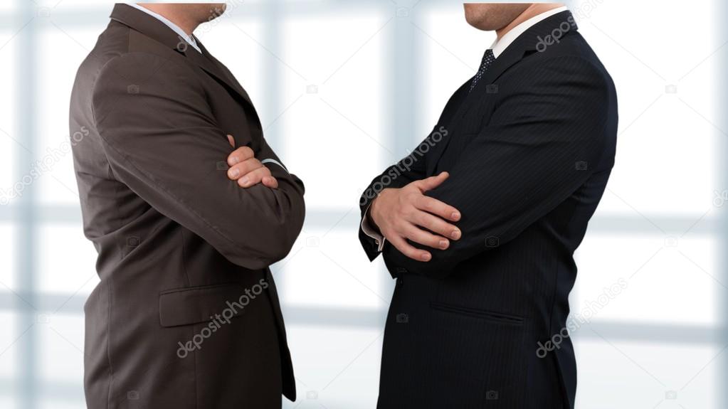 Businessmen in Business Suits with Crossed Arms