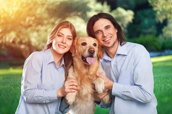 Happy Young Couple Playing Dog Park Outdoors —  Fotos de Stock