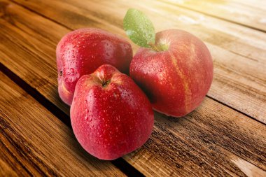 Shiny fresh ripe red apples on a background. clipart