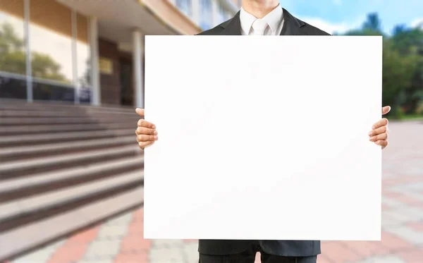 Business Man Holds Big White Billboard Table — Stock Photo, Image