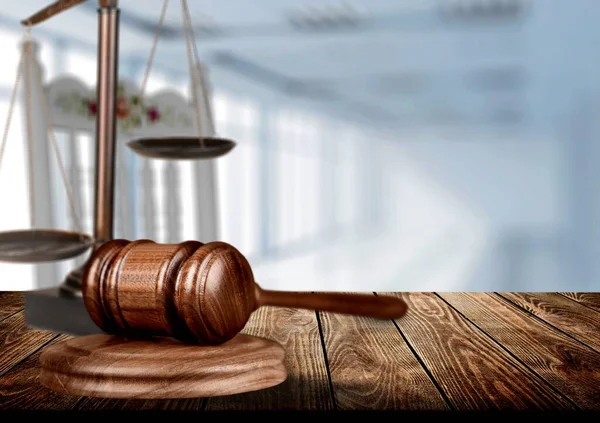 Justice and law concept. Gavel on a wooden table in morning light