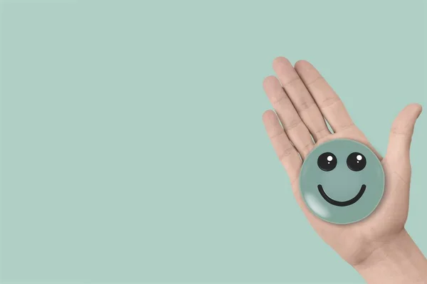 Χέρι Κρατώντας Ένα Πράσινο Εικονίδιο Του Προσώπου Χαμόγελο Θετική Σκέψη — Φωτογραφία Αρχείου
