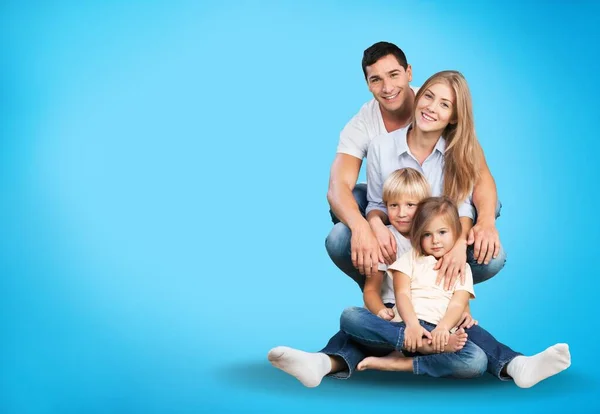 Feliz Familia Amantísima Hombre Mujer Niño Sentados Suelo Estudio Azul — Foto de Stock