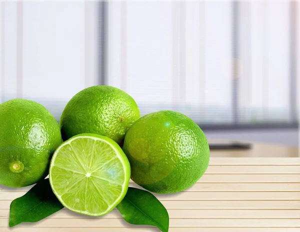 Juicy green lime fruits with green leaf and cut in half slice