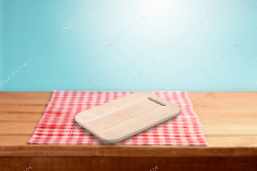 Empty blank wooden board for the dish on the desk. Kitchen background.