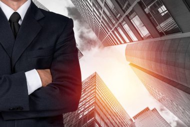 businessman standing in front of cityscape background