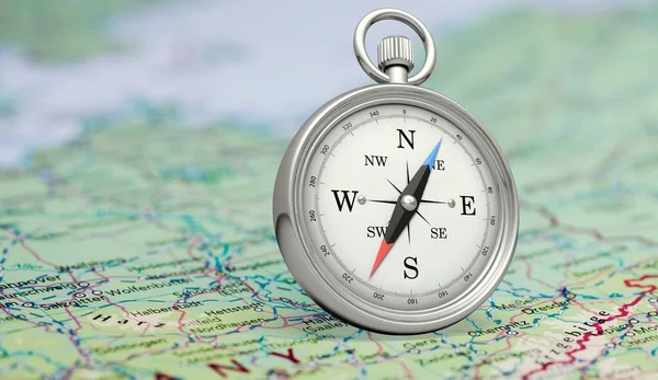 compass and map of the old world on background, close up