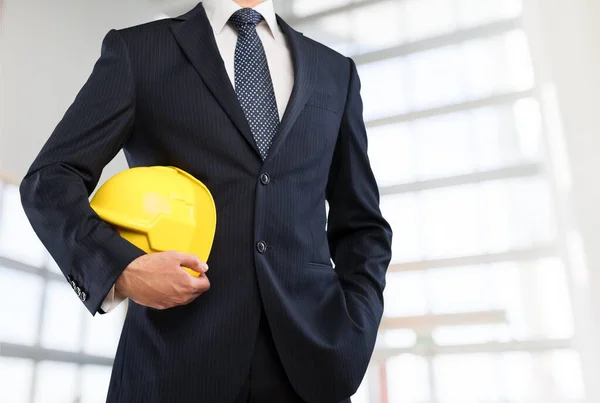 Mann Mit Helm Der Hand Hintergrund Nahaufnahme — Stockfoto