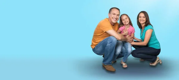 Feliz Familia Amantísima Hombre Mujer Niño Sentados Suelo Estudio Azul —  Fotos de Stock