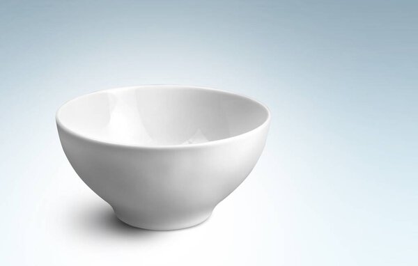 Empty white ceramic bowl on a kitchen desk