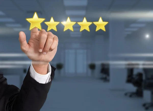A man in a business suit gives a five stars rating, classification.
