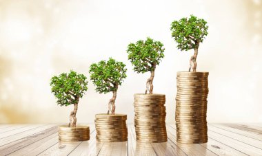 Madeni paranın üzerinde büyüyen yeşil bir ağaçla finansal gelişmeleri ve iş büyümesini gösteriyor.