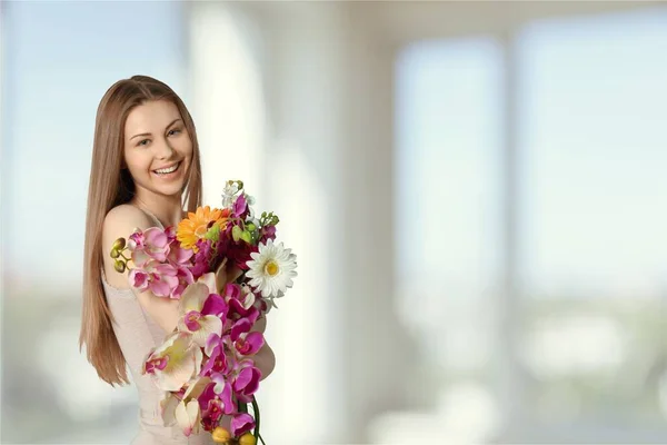 Happy Young Woman Hugging Flowers — Stock Photo, Image