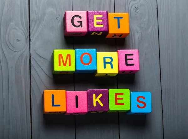 Facebook. Get More Likes card with colorful background with defocused lights — Stock Photo, Image