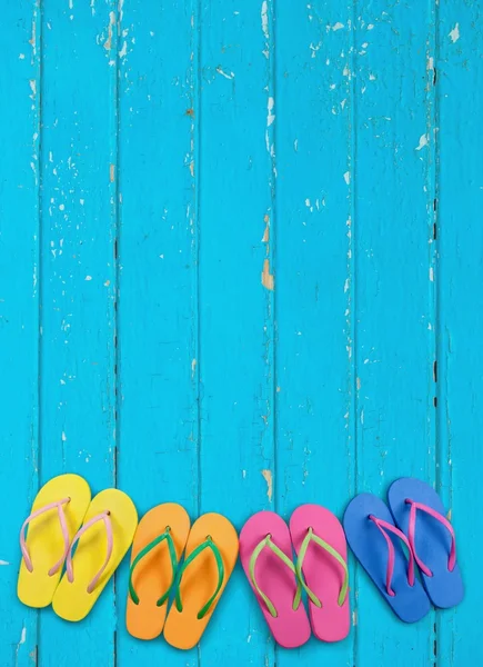 Summer. Flip flops with blue decking — Stock Photo, Image