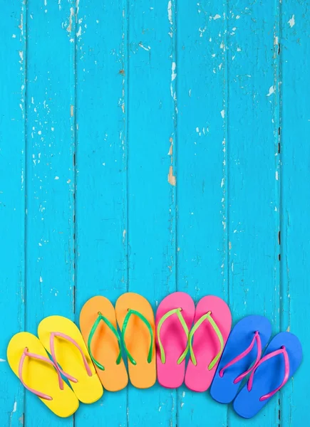 Summer. Flip flops with blue decking — Stock Photo, Image