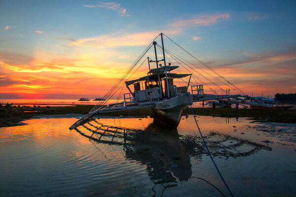 boat on the water at sunset in phillipines