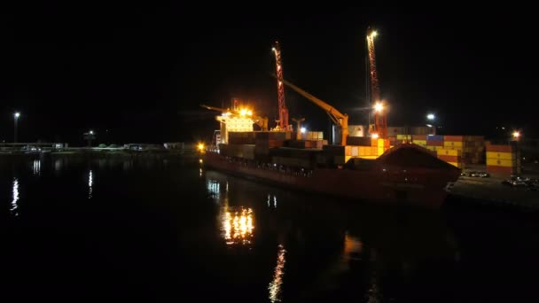 Unloading Cargo from a Ship in the Sea Port of Batumi by Night. Time Lapse — Stock Video