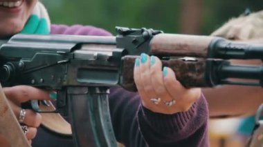 Woman Holds in Hands Machine Gun
