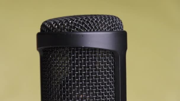 Studio Condenser Microphone Rotates on Yellow Background with Place for Text — Stock Video