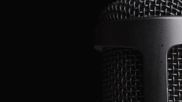 Studio Condenser Microphone Rotates on Black Background with Place for Text — Stock Video