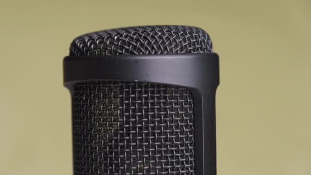 Studio Condenser Microphone Rotates on Yellow Background with Place for Text — Stock Video