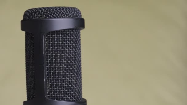 Studio Condenser Microphone Rotates on Yellow Background with Place for Text — Stock Video