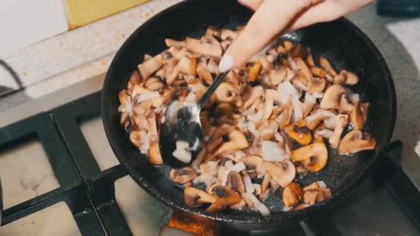 Women Hand Mixes Sauteed Mushroom in a Pan at Home Kitchen, Cooking Julienne — стокове відео