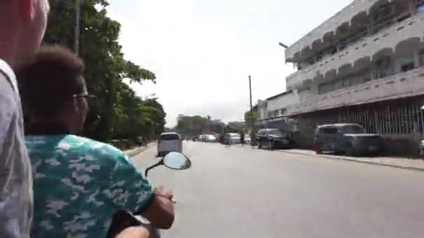 Riding Scooter by Busy African Road with Left-Hand Traffic, Stone Town, Zanzibar — Stock video