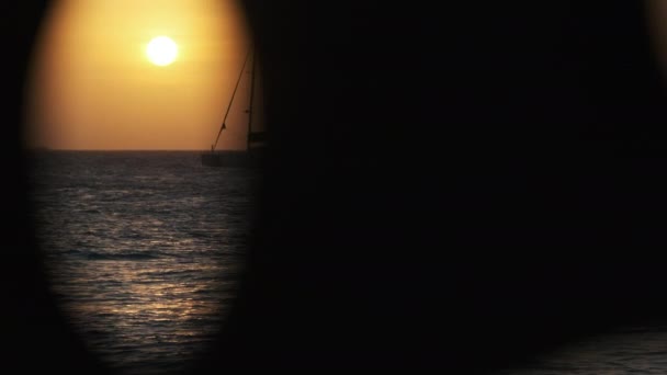 Silhouette Yacht with High Mast Sails at Sunset in the Ocean, Zanzibar, Africa — стокове відео