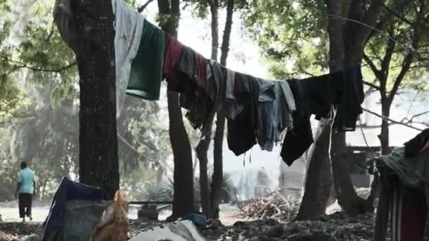 Clothes are dried on a clothesline in a poor African village in Zanzibar, Africa — Stock Video