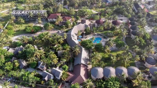 Aerial view African Tropical Beach Resort, Thatched-Roof Hotels, Pools, Zanzibar — 图库视频影像