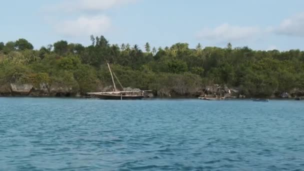 View from Ocean to Wooden Fishing Boats Anchored near Coast of African Village — Stock Video