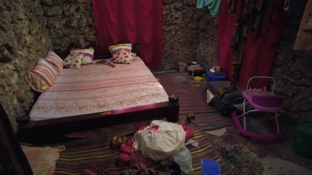 African Bedroom Inside a Slum Home, Dark Room with Bare Stone Wall, Zanzibar — Stok video