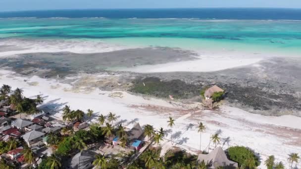 The Rock Restaurant in Ocean Built on Stone at Low Tide on Zanzibar, Aerial View — стокове відео