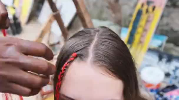 Process of Weaving African Braids with Red Kanekalon Outdoor, Zanzibar, Africa — Stock Video