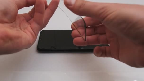 Sticking Protective Glass on the Smartphone Screen, Change Cracked Safety Glass — Stock Video