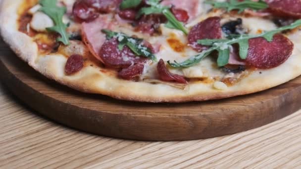 Appetizing Pizza on a Wooden Board in a Restaurant — Stock Video