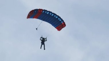 The Parachutist Flying and Lands At the Field, Extreme Sport