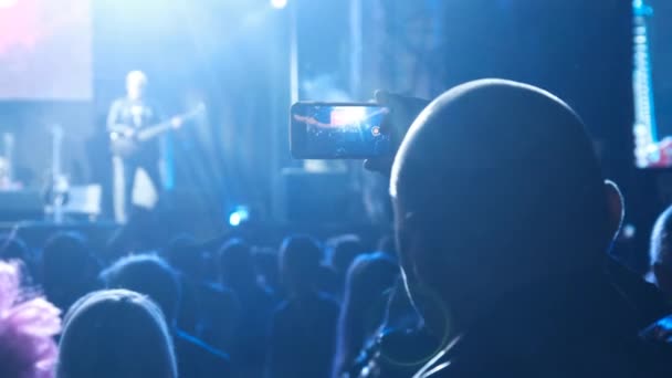 People Filming Rock Concert on Smartphone, Silhouettes Crowd of Fans Dancing — стокове відео
