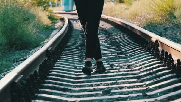 Young Beautiful Woman Walks Alone on the Railway Track — Stock Video