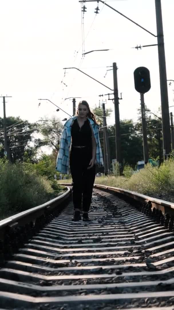 Vertical Video Young Beautiful Woman Walks Alone on the Railway Track — 비디오