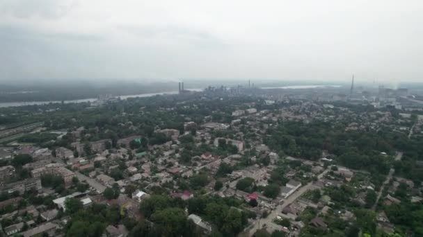 Aerial View of the City near a Large Industrial Plant with Pipes and Smoke — Stock Video