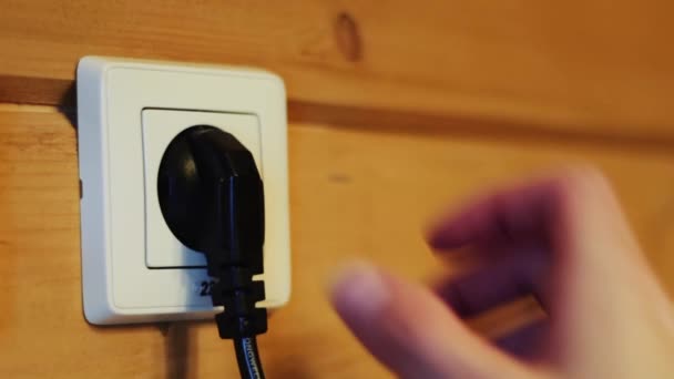 Inserting the plug into the socket — Stock Video